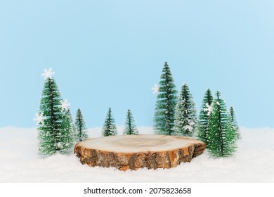 Wooden Podium In The Snow To Display Winter Products, Gift Or Cosmetics. Christmas And New Year Pedestal For Product Presentation