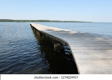 The Wooden Pontoon On The Lake