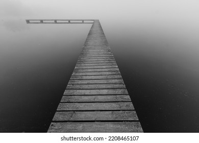 Wooden Pontoon On A Lake In The Autumn Mist