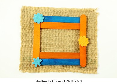 Wooden Popsicle Stick Frame Isolated With Copy Space As Background