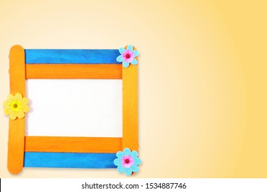 Wooden Popsicle Stick Frame Isolated With Copy Space As Background