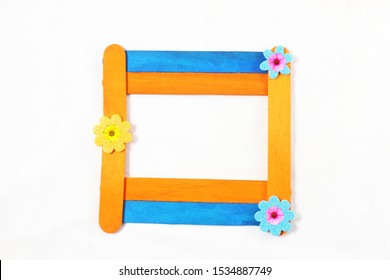 Wooden Popsicle Stick Frame Isolated With Copy Space As Background