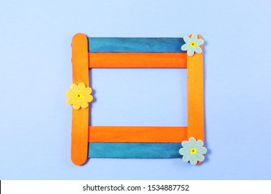 Wooden Popsicle Stick Frame Isolated With Copy Space As Background