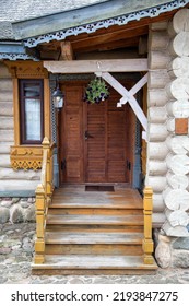 Wooden Porch With Steps And An Entrance Door To The Village House. Ancient Architecture, Village Traditions