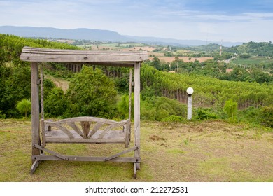 Wooden Porch Swing Hanging By Mountain