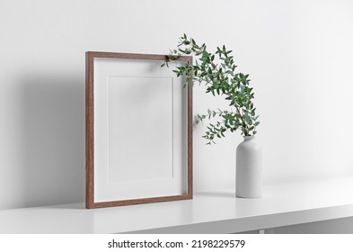 Wooden Portrait Frame Mockup In White Room Interior With Fresh Eucalyptus Plant In Vase