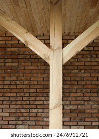 Wooden post with struts. Wooden construction. Wooden framework.