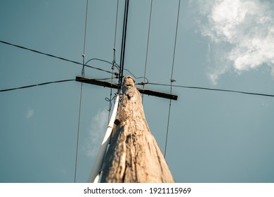 Wooden Power Pole With Cloudy Sky