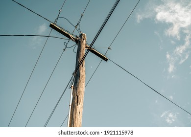 Wooden Power Pole With Cloudy Sky