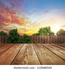 Wooden Product Table With Blurred Outdoor Backyard Background                  