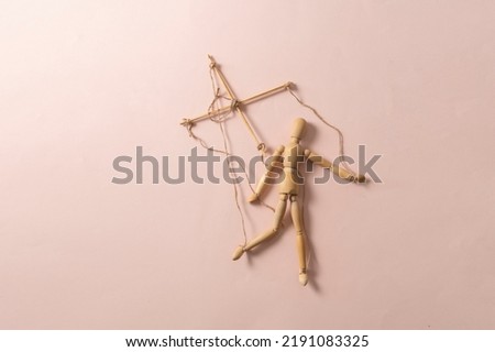 wooden puppet marionette doll with threads isolated flat lay