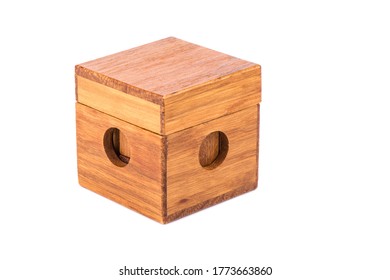 Wooden Puzzle Cube 7 In A Closed Wooden Box. Wooden Puzzle Isolated On White Background.