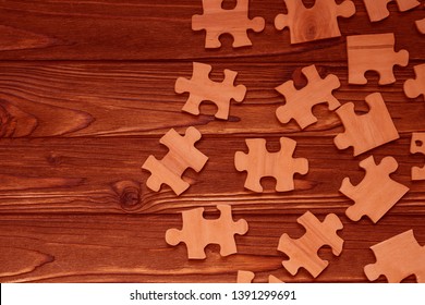 wooden puzzle on a wooden background. logical game, interaction. component.