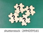 wooden puzzle with a question mark symbol. Concept of question, FAQ, Q and A, confusion and solution. question and answer concept