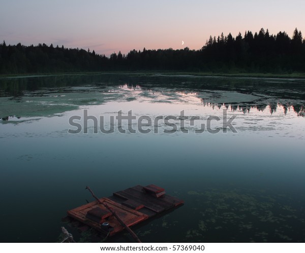 Wooden raft in\
pond