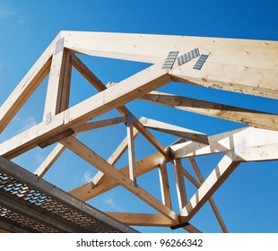 Wooden Rafters Against The Blue Sky