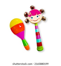 Wooden rattle and plastic rattle toys for new born baby. Musical infant toy isolated on white background with copy space, selectivel focus on subject