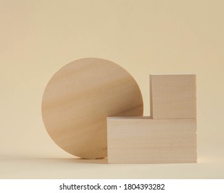 Wooden rectangular shapes on a beige background. Abstract geometric shapes. Empty podiums for your product. Minimalism