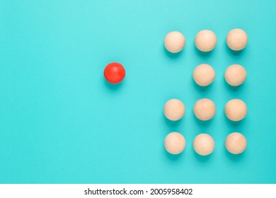 A wooden red ball be apart from the group of the similar balls, individual or disruption concept - Shutterstock ID 2005958402
