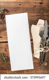 Wooden Restaurant Table With Blank Menu Vertical