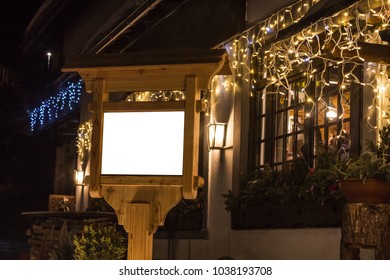 Wooden Resturant Sign Outside Night Lights