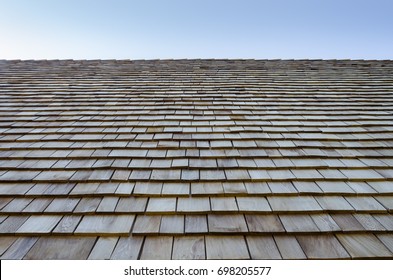 Wooden retro style roof texture in vintage house with blue sky