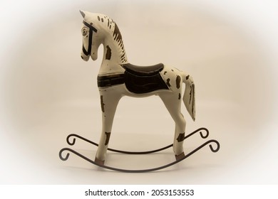 Wooden rocking horse toy on a light background