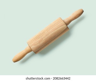 Wooden Rolling Pin Isolated On Green Background, Top View