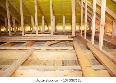 Wooden Roof Beams, Rafters, Trusses,  Frame House Attic Insulation Construction.  Roofing Construction Attic Interior. 