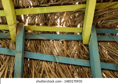 Wooden Roof Construction, Beach Hut Or Shack Interior, Covered With Dry Palm Leaves, Yellow And Turquoise Blue 