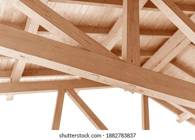 Wooden roof construction. Rafters and roof beams close-up.