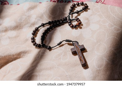 Wooden Rosary Cross Symbolizing Christianity And The Lenten Season