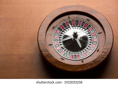 Wooden roulette isolated on wood background