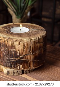 Wooden Round Candle Holder With Candle. Natural Wood Texture Closeup