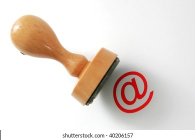 Wooden rubber stamp - internet law. "@" is in focus, stamper is not