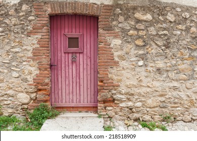 Wooden Rustic Door In Stone Wall