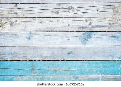 Wooden rustic retro background - gray old boards with the remains of blue paint