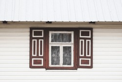 Wooden Rustic Window In Cottage House. Lace Curtains Glass Window Home. Rusty Architecture In Poland Vintage Wall. Decorative Exterior Shutters. White Wood Home Wall Facade. Metal Roof.