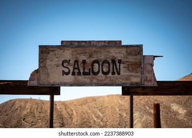 Wooden Saloon Sign in Old Wild West Ghost Town - Shutterstock ID 2237388903