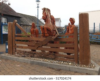 Wooden Sculpture, Depicting The Rebecca Riots Of 1839, In The Small Welsh Town Of St Clears, Carmarthenshire, Wales, UK Taken In November 2016.