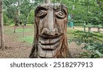 Wooden sculptures in the botanical garden, they look mystical and mysterious