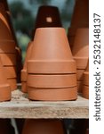 Wooden shelf with empty terracotta flower pots