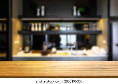 Wooden shelf with knife and blurred modern kitchen background cooking food. Stylish kitchen interior design. - Shutterstock ID 2058195305
