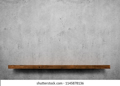 Wooden Shelf Over Grey Concrete Wall Background