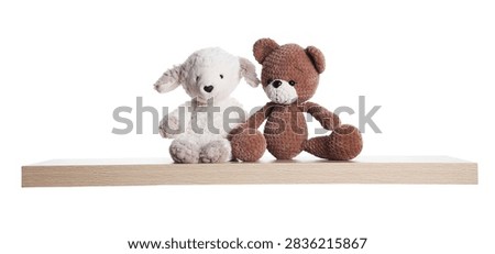 Wooden shelf with stuffed animals isolated on white