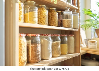 Wooden Shelves In Pantry For Food Storage, Grain Products In Storage Jars.