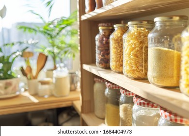 Wooden Shelves In Pantry For Food Storage, Grain Products In Storage Jars.