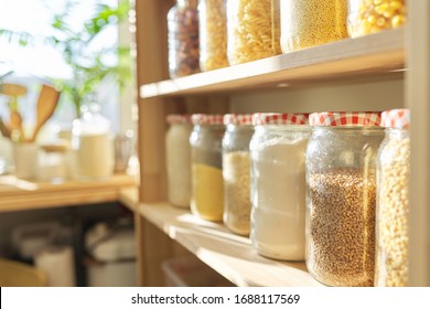 Wooden Shelves In Pantry For Food Storage, Grain Products In Storage Jars.