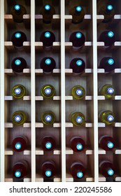 Wooden Shelves With Wine Bottles At  Cafe 