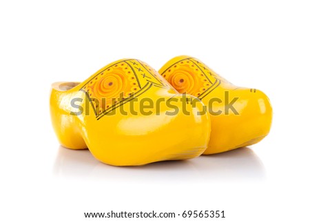 Wooden shoes, traditional dutch footwear for farmers, isolated on white background